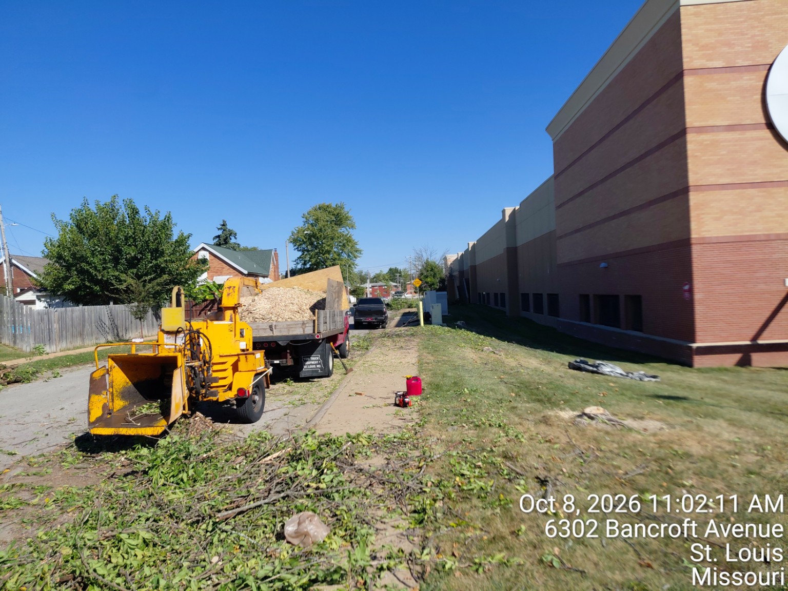 Chipper, truck and brush during site cleanup