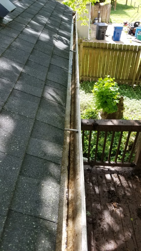 Residential gutter before cleaning by Prayers Lawn & Landscape