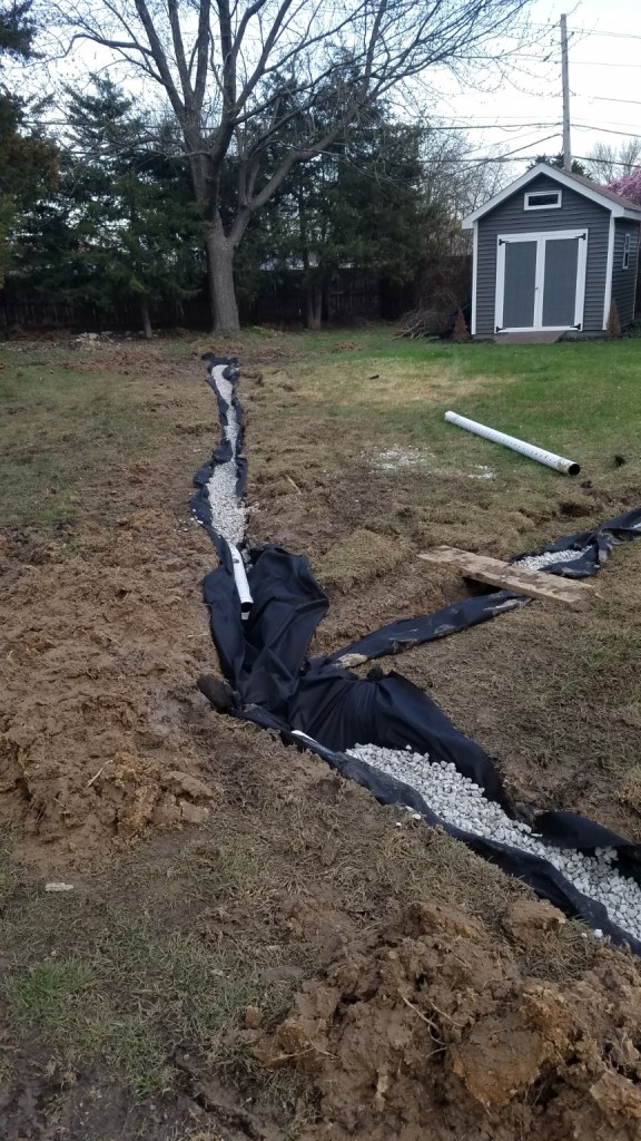 French drain and drainage trench installation by Prayers Lawn & Landscape